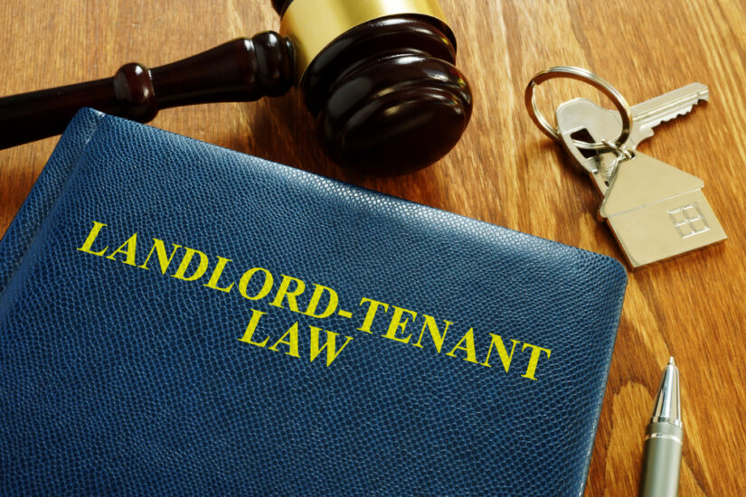 Landlord Tenant Law Book With Judges Hammer, Keys And Pen