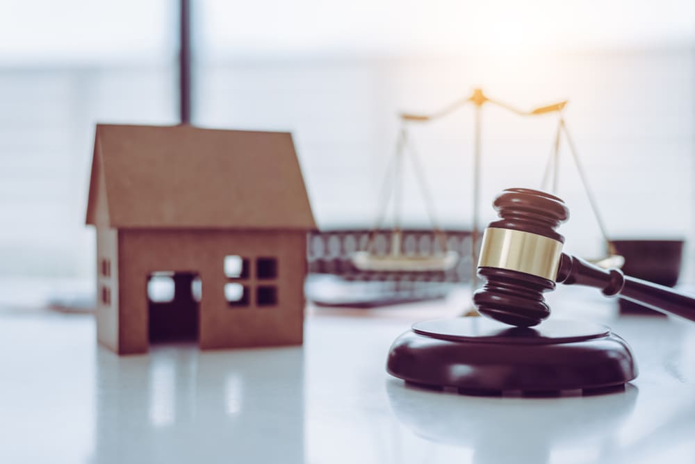 toy house and a gavel on the table